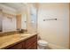 Beautiful bathroom featuring granite countertop and dark wood cabinets at 1211 Thornwell Ne Dr, Brookhaven, GA 30319