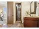 Elegant bathroom featuring tiled shower with glass door and vanity at 1211 Thornwell Ne Dr, Brookhaven, GA 30319
