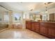 Luxurious bathroom features a glass shower, soaking tub, and a large vanity with granite countertops at 1211 Thornwell Ne Dr, Brookhaven, GA 30319