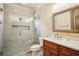 Beautiful bathroom featuring a glass enclosed shower, and a wood vanity with a quartz countertop at 1211 Thornwell Ne Dr, Brookhaven, GA 30319
