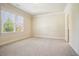 Cozy bedroom with a large window overlooking a tree and neutral carpet at 1211 Thornwell Ne Dr, Brookhaven, GA 30319