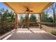 Spacious outdoor deck with ceiling fan overlooking private backyard at 1211 Thornwell Ne Dr, Brookhaven, GA 30319