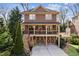 Attractive two-story home with a charming porch, featuring a convenient two-car garage and landscaped surroundings at 1211 Thornwell Ne Dr, Brookhaven, GA 30319