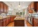 Well-equipped kitchen featuring a center island, stainless steel appliances, and stylish pendant lighting at 1211 Thornwell Ne Dr, Brookhaven, GA 30319