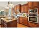Lovely kitchen includes a built-in microwave and oven combo, custom hood vent and granite countertops at 1211 Thornwell Ne Dr, Brookhaven, GA 30319