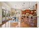 Eat-in kitchen with stainless steel appliances, a breakfast bar, pendant lighting and doors to outdoor patio at 1211 Thornwell Ne Dr, Brookhaven, GA 30319