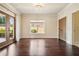 Bright living room featuring hardwood floors, large windows and doors, and elegant trim at 1211 Thornwell Ne Dr, Brookhaven, GA 30319