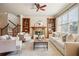 Bright living room with fireplace, built-in bookshelves, and large windows that provide ample natural light at 1211 Thornwell Ne Dr, Brookhaven, GA 30319