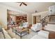 Open-concept living room with hardwood floors and clear view to kitchen and dining area at 1211 Thornwell Ne Dr, Brookhaven, GA 30319