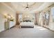Spacious main bedroom with tray ceiling, many windows and balcony access at 1211 Thornwell Ne Dr, Brookhaven, GA 30319