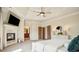 Bedroom featuring a fireplace, TV, and double doors to bathroom at 1211 Thornwell Ne Dr, Brookhaven, GA 30319