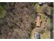 An aerial perspective showcases the property with a treed landscape at 133 Hickory Trl, Cumming, GA 30040