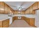 Functional kitchen with ample cabinet space and white countertops at 133 Hickory Trl, Cumming, GA 30040