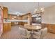 Cozy kitchen with wood cabinets and an adjacent dining area for casual meals at 133 Hickory Trl, Cumming, GA 30040