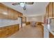 Spacious kitchen and breakfast nook with wood cabinets, tile flooring, and natural light at 133 Hickory Trl, Cumming, GA 30040