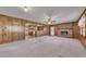 Open living room featuring a brick fireplace and seamless flow to the kitchen at 133 Hickory Trl, Cumming, GA 30040