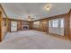 Spacious living room with a brick fireplace and ample natural light at 133 Hickory Trl, Cumming, GA 30040