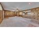 Large living room featuring paneled walls and an open floorplan at 133 Hickory Trl, Cumming, GA 30040