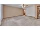 Large main bedroom features neutral carpeting and a wallpaper accent wall at 133 Hickory Trl, Cumming, GA 30040