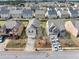 Street view of homes with well-maintained lawns and paved driveways in a residential community at 1332 Worcester Trl, Mcdonough, GA 30253