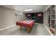 Basement game area featuring a pool table, fireplace, and custom shelving at 2870 Carla Nw Dr, Kennesaw, GA 30144