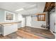 Basement area with hardwood floors, windows, and a utility area at 2870 Carla Nw Dr, Kennesaw, GA 30144