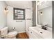 Updated bathroom with a walk-in shower, new vanity, and modern fixtures at 2870 Carla Nw Dr, Kennesaw, GA 30144