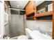 A full bathroom featuring a walk-in shower, a sink, and wooden cabinets at 2870 Carla Nw Dr, Kennesaw, GA 30144