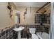 This full bathroom features a sink, a bathtub, and a tiled wall at 2870 Carla Nw Dr, Kennesaw, GA 30144
