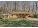 Charming ranch-style home featuring a brick facade, covered carport, and inviting front yard space at 2870 Carla Nw Dr, Kennesaw, GA 30144