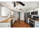 Spacious kitchen featuring modern lighting, stainless steel appliances, and butcher block countertops at 2870 Carla Nw Dr, Kennesaw, GA 30144