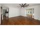 Spacious living area showcasing hardwood floors, and open access to the kitchen and sunroom at 2870 Carla Nw Dr, Kennesaw, GA 30144