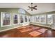 Bright sunroom with vaulted ceilings, ceiling fan, hardwood floors and many windows at 2870 Carla Nw Dr, Kennesaw, GA 30144