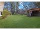 Green backyard with open shed providing extra storage space, perfect for outdoor activities at 2911 Botany Dr, Jonesboro, GA 30236