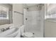 Modern bathroom featuring a new shower and updated vanity with a bright window at 2911 Botany Dr, Jonesboro, GA 30236