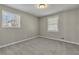 Inviting bedroom with neutral carpeting, ample natural light from two windows, and cozy feel at 2911 Botany Dr, Jonesboro, GA 30236