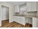 Renovated kitchen with white cabinets, granite countertops and new flooring at 2911 Botany Dr, Jonesboro, GA 30236