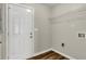 Laundry room with white door and wire shelving at 2911 Botany Dr, Jonesboro, GA 30236