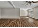 Open living room area with wood-look flooring, bright light, and neutral color scheme at 2911 Botany Dr, Jonesboro, GA 30236
