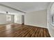 Spacious living area with wood floors, a large window, neutral tones and plenty of natural light at 2911 Botany Dr, Jonesboro, GA 30236