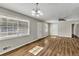 Open living room area with wood-look flooring, bright light, and neutral color scheme at 2911 Botany Dr, Jonesboro, GA 30236
