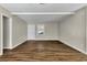 Bright and airy living room featuring wood flooring, neutral walls, and a ceiling fan at 2911 Botany Dr, Jonesboro, GA 30236