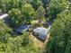 Aerial view of house nestled in a leafy neighborhood, showing mature trees and a private setting at 1893 Burning Tree Dr, Decatur, GA 30032