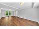 A renovated basement featuring wood floors and bright French doors to the outside at 1893 Burning Tree Dr, Decatur, GA 30032