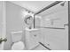 Modern bathroom features a glass shower, vanity with sleek fixtures, and ceramic tile floor at 1893 Burning Tree Dr, Decatur, GA 30032