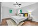 Bedroom featuring windows, ceiling fan, hardwood floors and modern decor at 1893 Burning Tree Dr, Decatur, GA 30032