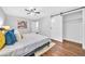 Modern bedroom features a ceiling fan, gray walls, and a convenient sliding barn door closet at 1893 Burning Tree Dr, Decatur, GA 30032
