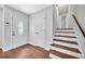Inviting entrance showcasing elegant staircase and wood-look floors at 1893 Burning Tree Dr, Decatur, GA 30032
