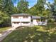 Charming two-story home with manicured lawn and brick accents at 1893 Burning Tree Dr, Decatur, GA 30032
