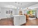 Bright and open living room featuring hardwood floors, modern lighting, and neutral decor at 1893 Burning Tree Dr, Decatur, GA 30032